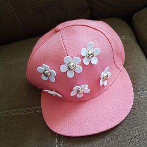 Claire's Pink ladies Ball cap with daisies on the front